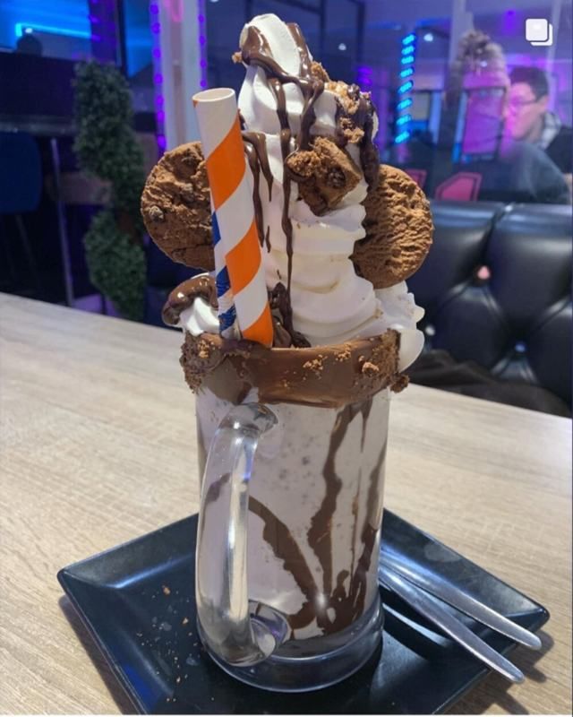 A cookie-topped chocolate monster shake shared by foodfindslucy